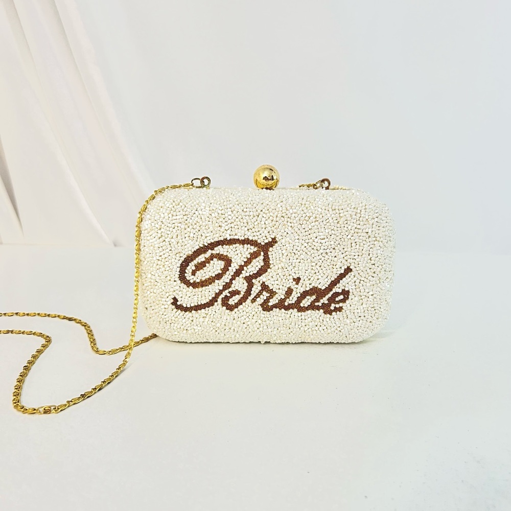 White Beaded Mini Purse embroidered the word “Bride” and gold chain strap.